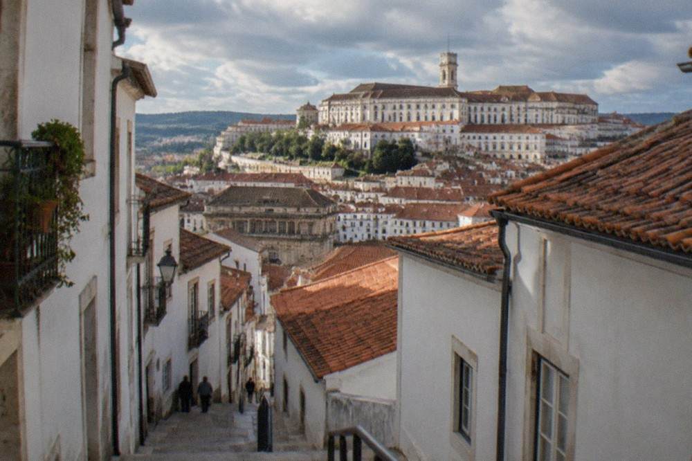 View over the tiled roofs and university buildings of Coimbra from the upper town