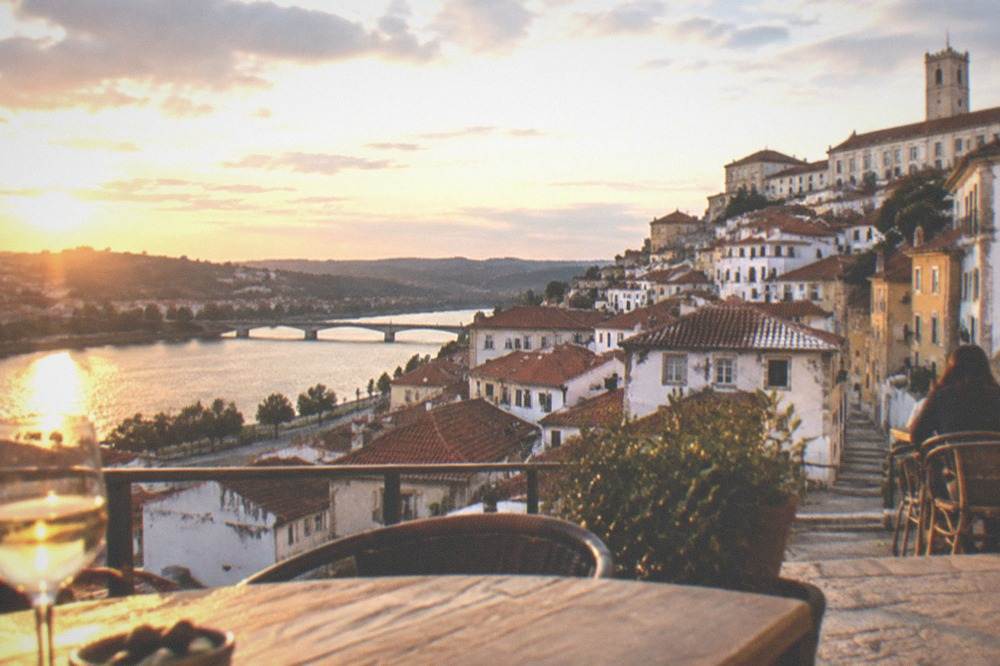 Evening terrace with views over the rooftops and river in Coimbra