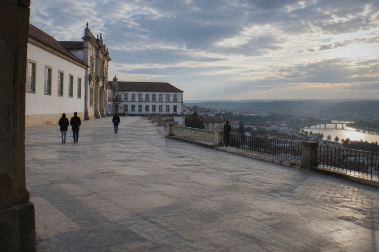 The grand facade of the University of Coimbra buildings on the hill above the River Mondego