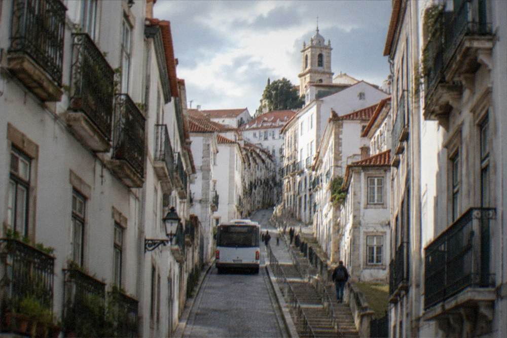 A city bus on a narrow street in the upper town of Coimbra