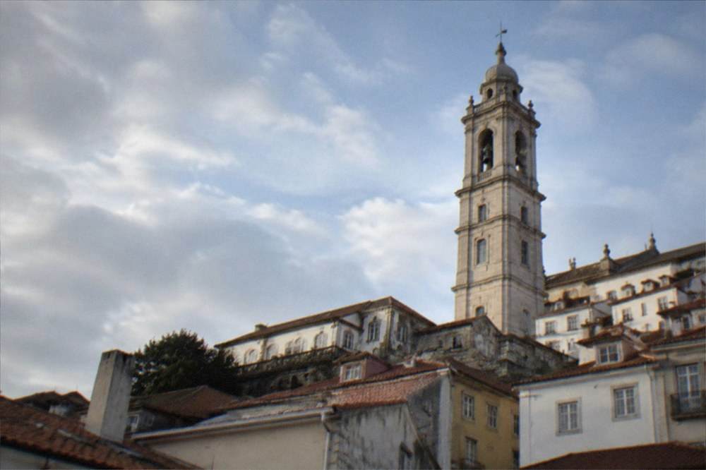 View over the rooftops of Coimbra with the university tower rising above the old town