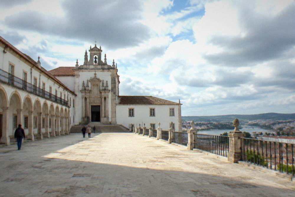 A view along the arcaded courtyard of the Paço das Escolas with the chapel entrance in the background