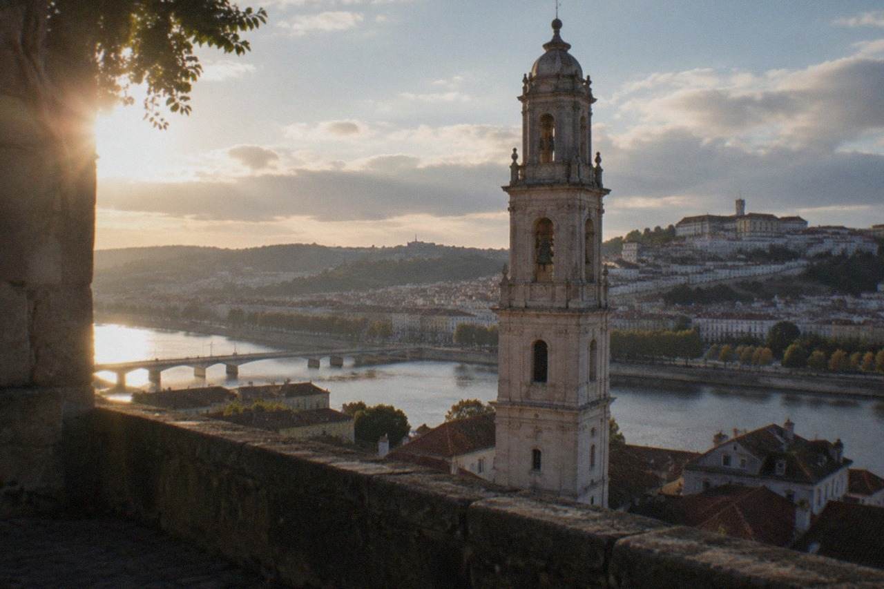 The hillside city of Coimbra with the University tower rising above the River Mondego