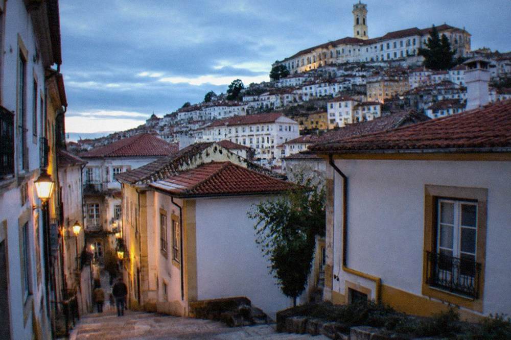 The walled old town of Evora with low whitewashed houses under a wide sky