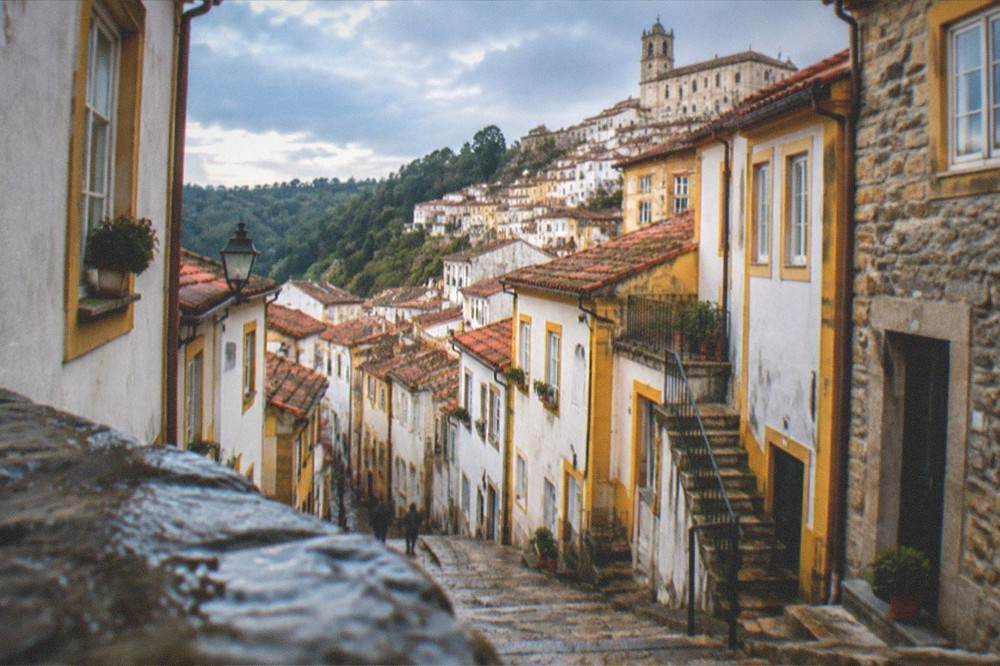 Stone schist houses on a forested mountainside in central Portugal