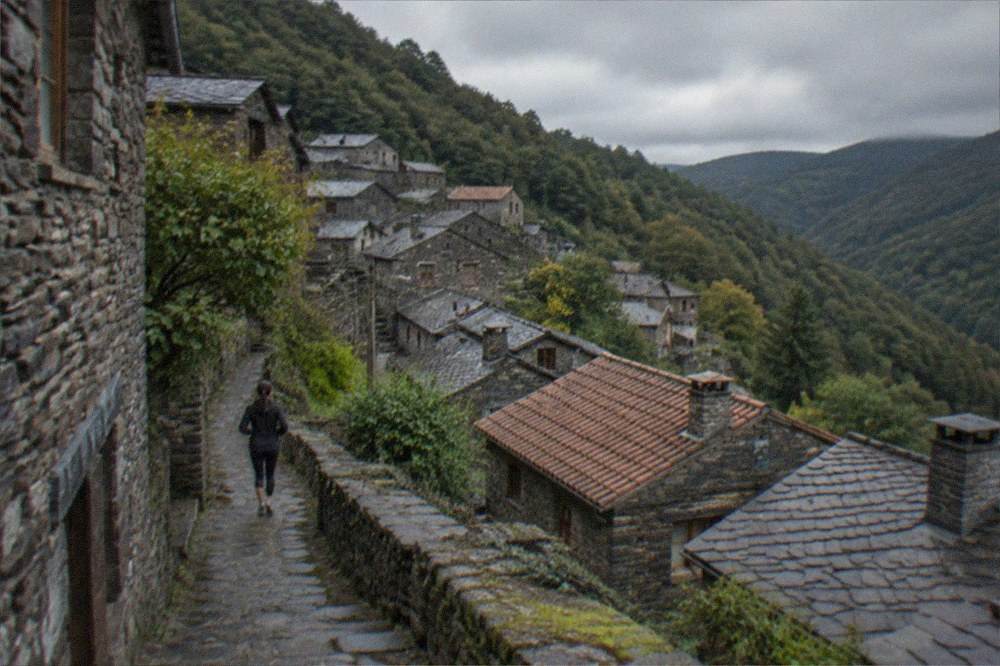 Stone schist village houses on a forested mountainside near Lousã