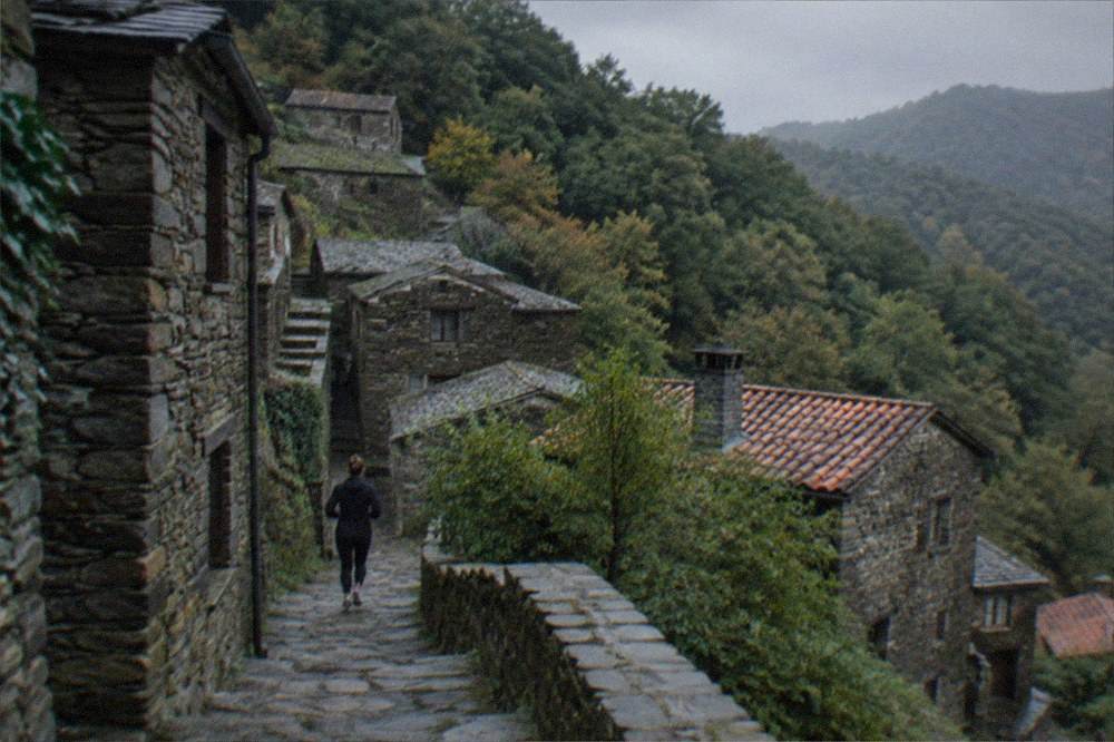 Stone schist village houses on a forested mountainside near Lousã in central Portugal