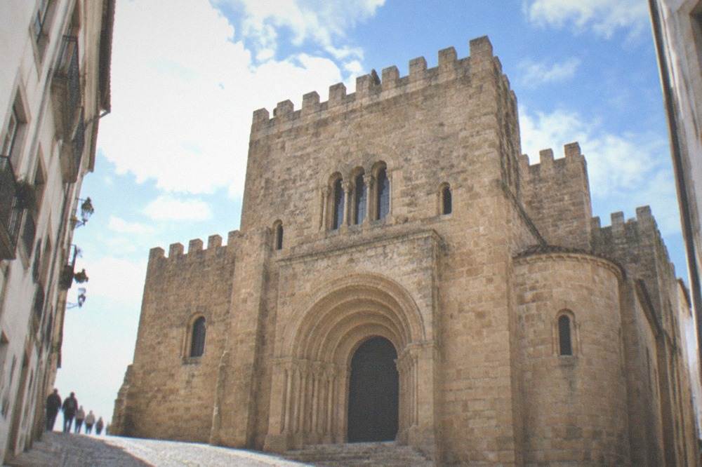 The Romanesque facade and battlements of the Sé Velha, the old cathedral of Coimbra