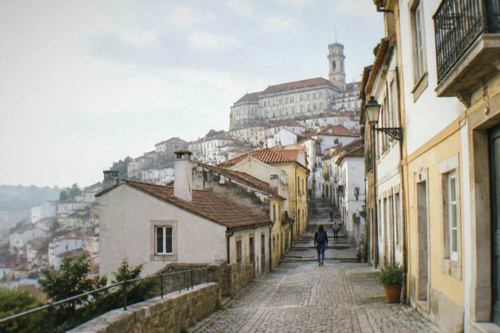 The steep cobbled lane leading up toward the university buildings in Coimbra's Alta