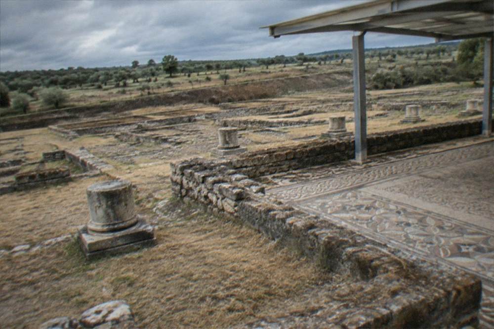 Roman column bases and mosaic floors at the Conímbriga archaeological site