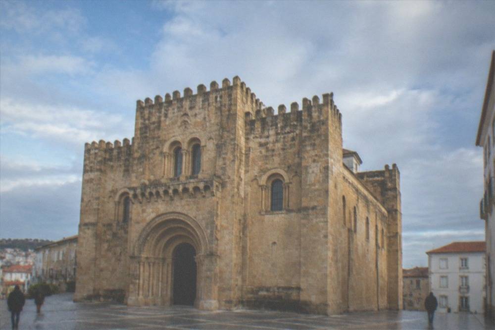 The Romanesque exterior of the Sé Velha old cathedral in Coimbra