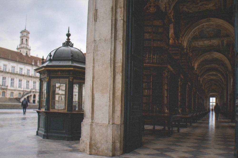 The Joanina Library ticket kiosk and courtyard of the University of Coimbra in morning light